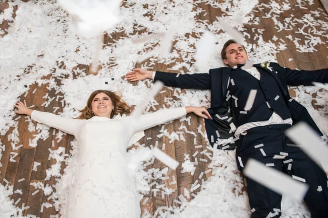 couple making confetti angels